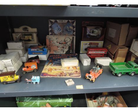 A shelf of mixed vintage diecasts including Corgi Chitty Chitty Bang Bang car with four passengers, Dinky Ford D800 Tipper. M