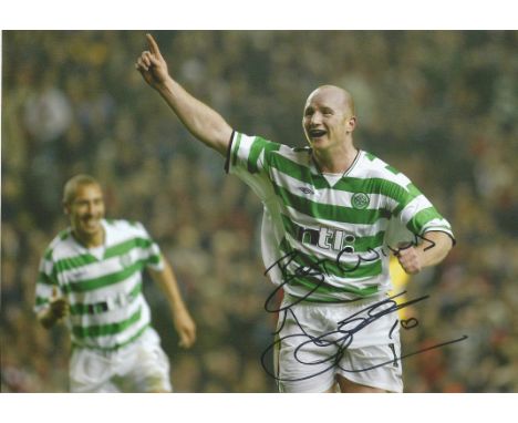 John Hartson Signed 8x12 Celtic Photo. Good condition. All autographs come with a Certificate of Authenticity. We combine pos