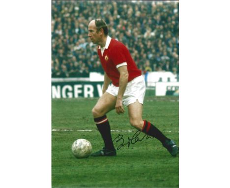 Football Bobby Charlton signed 12x8 colour photo pictured while playing for Manchester United. Good condition. All autographs