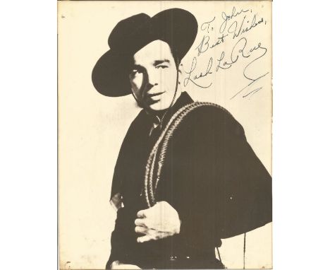 Lash Jack La Rue signed 14 x 11 b/w vintage photo in western costume, dedicated. Has faults signs of age condition 5/10, pric