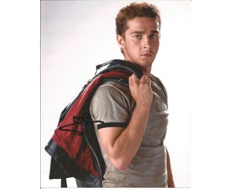 Shia LaBeouf signed 10x8 colour photo portrait. Good Condition. All signed pieces come with a Certificate of Authenticity. We