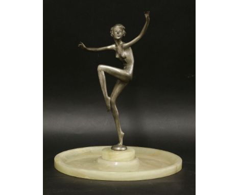 An Art Deco silvered bronze figure, by Adolph, on a dished onyx plinth, 36.5cm high, 30.5cm diameter