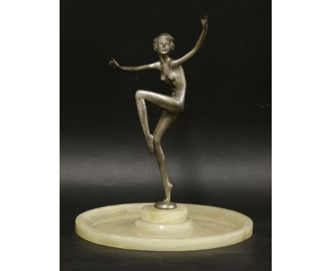 An Art Deco silvered bronze figure, by Adolph, on a dished onyx plinth, 36.5cm high, 30.5cm diameter