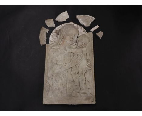 A marble low relief carving of the Madonna and child, probably late 19th century, the child standing on a tasselled cushion h