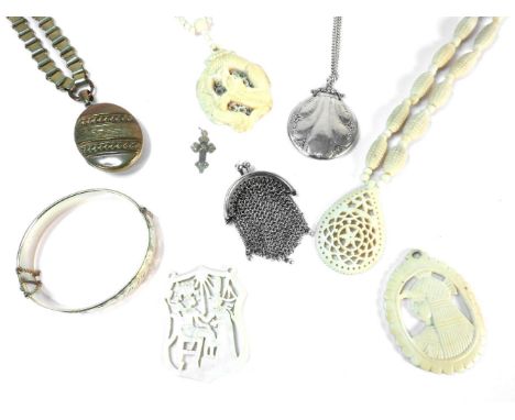 A collection of 19th century carved ivory jewellery, to include two necklaces with carved pendants, and other items including