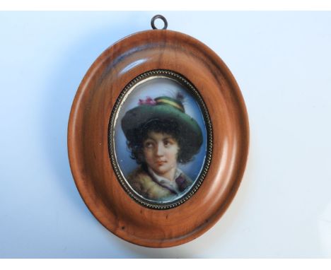 A 19th century oval porcelain portrait plaque, after original 'Peasant Boy' by Dominico Capaldi, 1807, 7.5cm high
