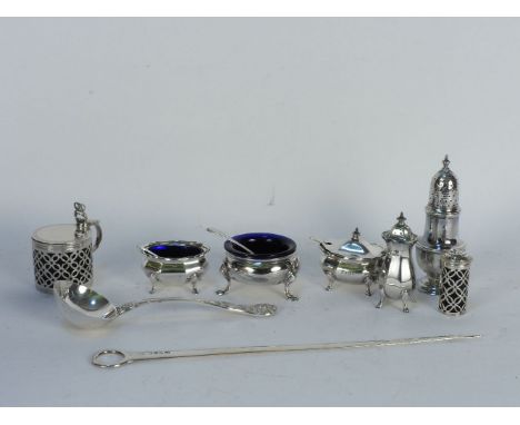 A collection of silver cruets, a skewer, and a silver sauce ladle (9)