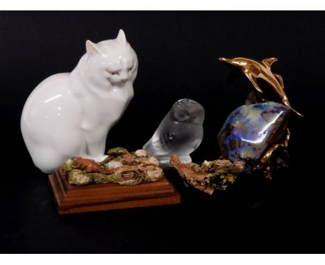 A Herend porcelain cat, a Lalique owl, an Australian resin figure of a platypus, and a bronze and opal figure of a dolphin le