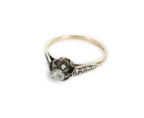 A gold single stone diamond ring, marked 18ct, one claw deficient