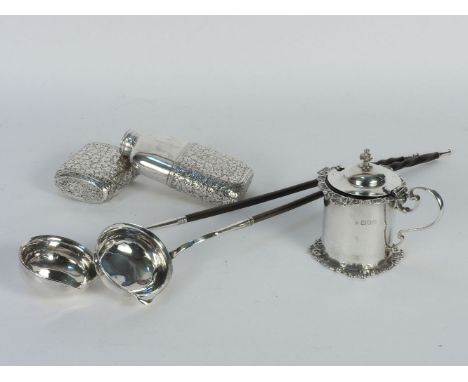 A hallmarked silver Georgian design mustard pot, two toddy ladles, and a white metal spirit flask (4)