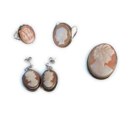 A gold shell cameo ring, marked 9ct, a shell cameo brooch, in silver mount, a pair of shell cameo earrings, and a gold shell 