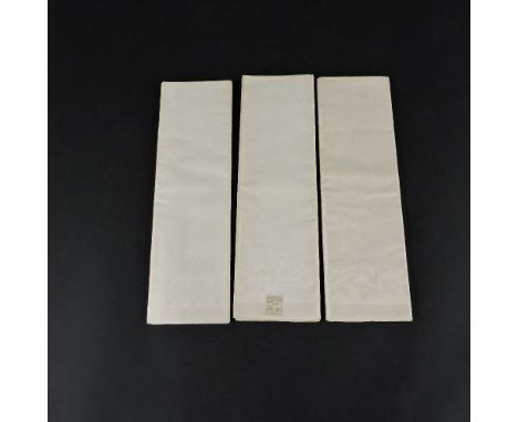 Three linen damask tablecloths,early 20th century, by Walpole Brothers, two woven with chrysanthemums and one woven with a fe