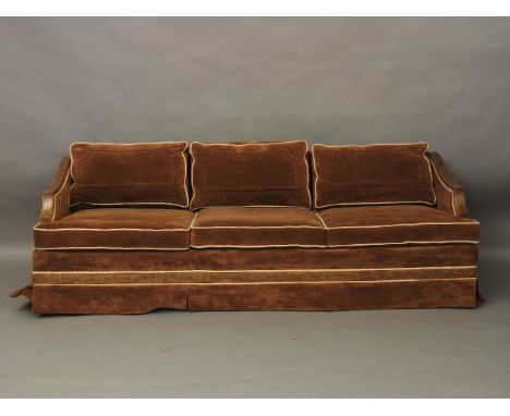 An Art Deco sofa, with walnut arms