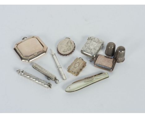 A silver gilt vinaigrette , of shaped rectangular form,  engraved 'Louisa', a vesta, compact, oval locket, stamp box, a foldi
