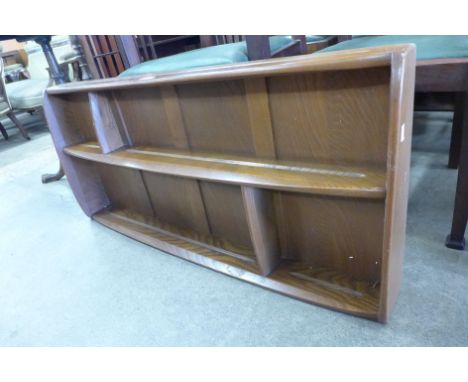 An Ercol Golden Dawn elm wall hanging plate rack 