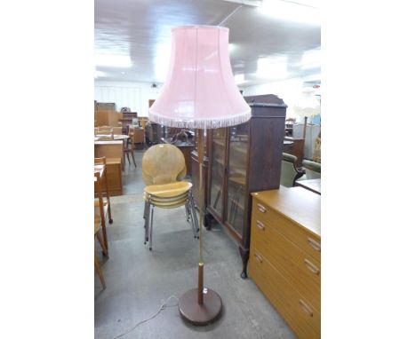 A teak standard lamp 