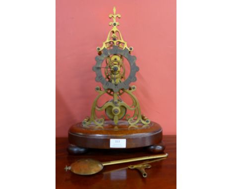 An early Victorian brass skeleton clock, on mahogany base 