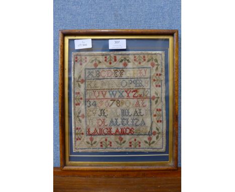 A Victorian needlework sampler, framed 
