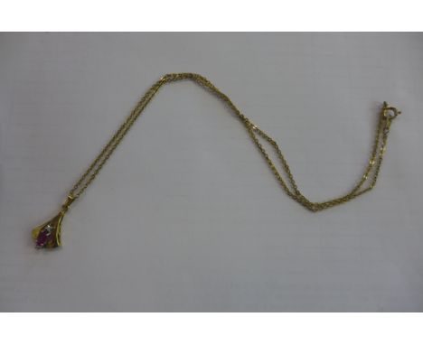 A 9ct Ruby and diamond pendant on a gilt metal chain, total weight approx 2.9 grams 