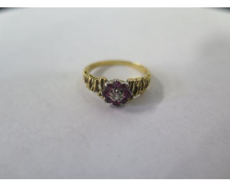 An 18ct gold diamond and ruby ring, size K, approx 3.2 grams, in good condition 