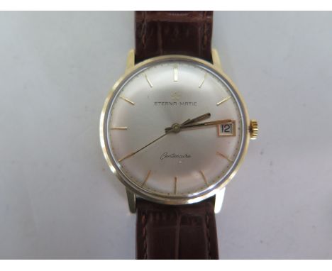 A 9ct Eterna Matic getns wrist watch, with calendar, on a faux crocodile strap, 33mm wide including button, running order, mi