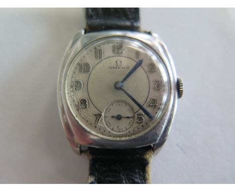 A 1930s gents Omega wristwatch with steel case, Arabic dial and a subsidiary dial, approx 30mm wide, including button, not cu