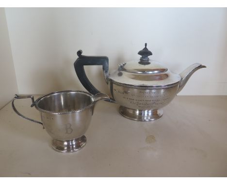 A silver teapot, a silver jug, approx 11 troy oz total 