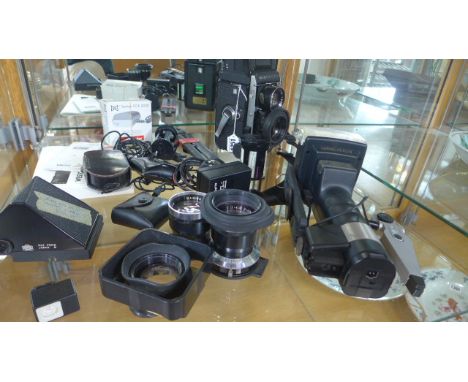 A Mamiya C330 Professional F body twin lens Reflex camera with two Mamiya-Sekor lenses 1.2.8 f 80mm, 1.4.5 f 135mm, and attac