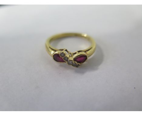 An 18ct gold ruby and diamond ring, size M, approx 3.2 grams, in good condition 