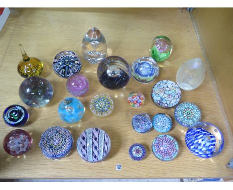 A collection of 23 paperweights, two by Caithness, largest overall approx 11cm 