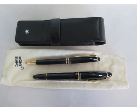 A Mont Blanc 4 Miesterstuck 146 fountain pen with 14K nib - and a Mont Blanc Meisterstuck roller ball pen with leather pouch 