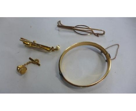 A collection of gold plated jewellery, two tie clips, a bangle and a stud - most in good condition but some tarnished areas 
