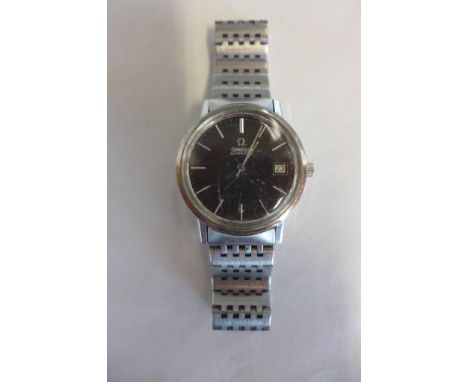 An Omega automatic stainless steel gents wristwatch with strap and black dial, 27mm wide including button, not currently runn