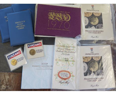 A collection of British coinage, including un-circulated British coins, first decimal coin sets 