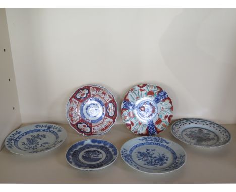 A collection of six 19th century oriental and European plates, with three blue and white, two Imari pattern plates and a gree