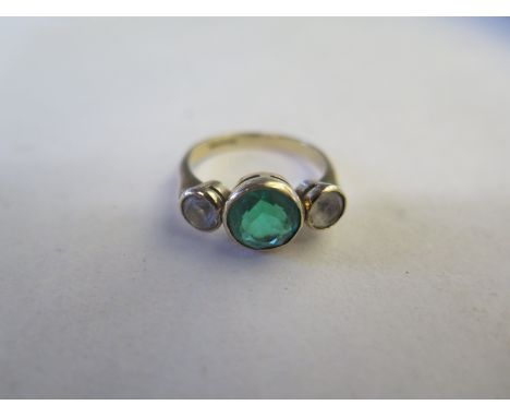 A 9ct yellow gold green and white stone three stone ring, size Q/R, approx 3.8 grams 