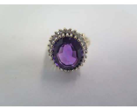 A 9ct yellow gold diamond and amethyst ring, size K, approx 4 grams, in good condition, minor abrasions 