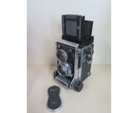 A Mamiya C33 professional twin lens Reflex camera with Mamiya-sekor 1.2.8 f 9mm lens, no 813732 