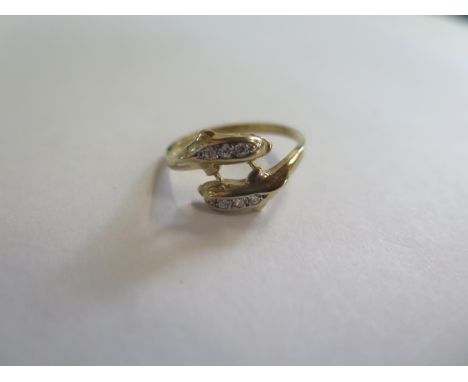 A 9ct gold and cz dolphin ring, size R, approx 2.8 grams, in good condition 