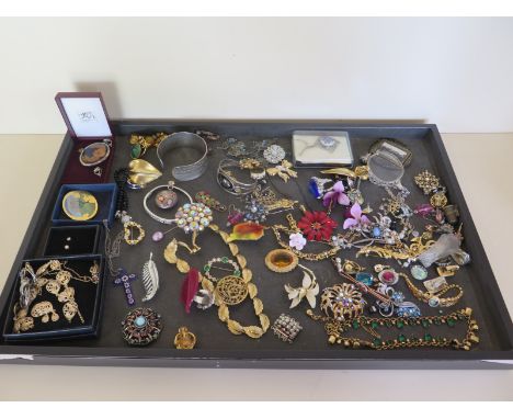 A collection of vintage costume jewellery including Uhlig, Hollywood and Sarah cos brooches, also bracelets, earrings, neckla