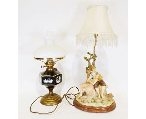 Capodimonte style table light of a male and female sitting under a tree, signed Vivien C, together with a modern oil lamp (2)