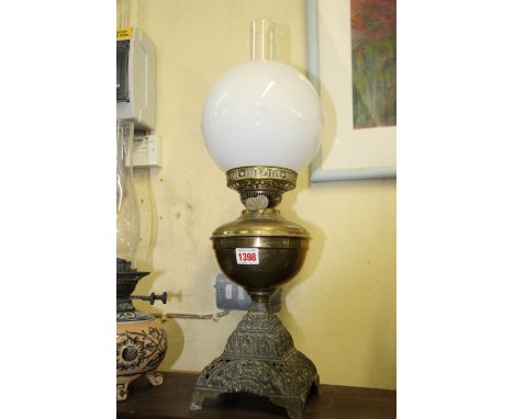 A Victorian brass and metal oil lamp.