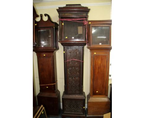 A Georgian carved oak longcase clock case, 214cm high. 