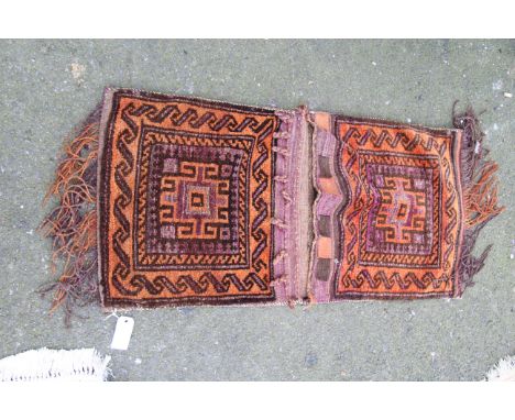 An Afghan Baluch carpet saddle bag.