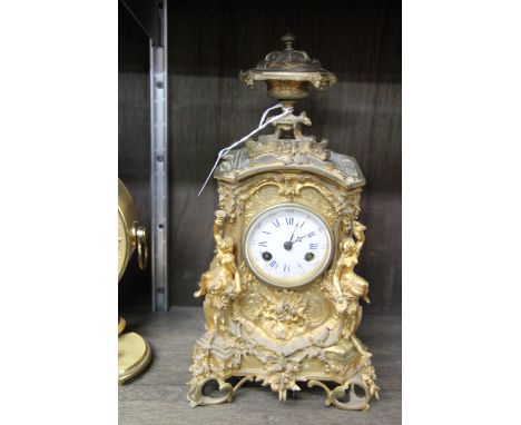 A 19th century gilt metal mantel clock, with circular enamel dial, 30cm high. 
