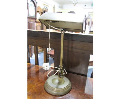 An old patinated brass desk lamp.