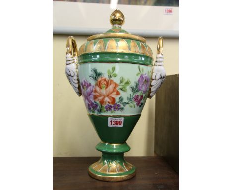 A Continental porcelain twin handled vase and cover, 36cm high. 