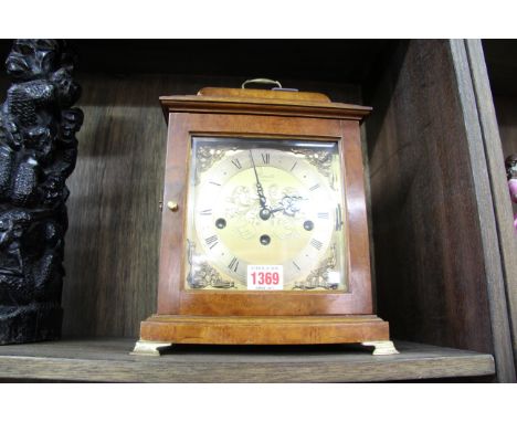 An 18th century style walnut musical mantel clock, by Comitti, height including handle 31cm.
