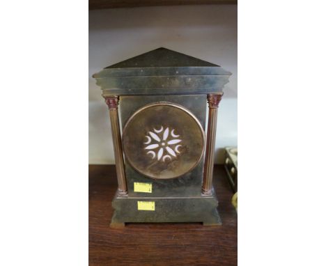 A late 19th century brass mantel clock, of architectural form, with enamel dial, 26.5cm high. 