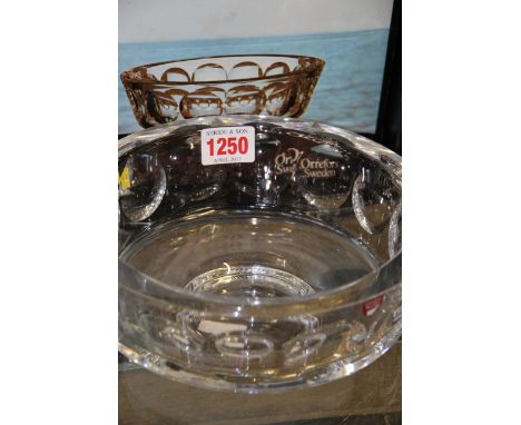 An Orrefors clear glass circular bowl, 19.5cm diameter, boxed; together with another Orrefors clear glass decanter and stoppe